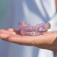 Hand holding an oral appliance