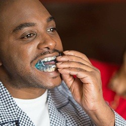 Man placing an oral appliance