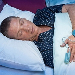 Man sleeping with heart monitor