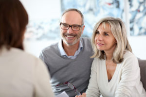 older couple talking with an expert