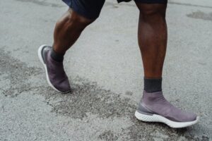 Close up of walking man’s feet