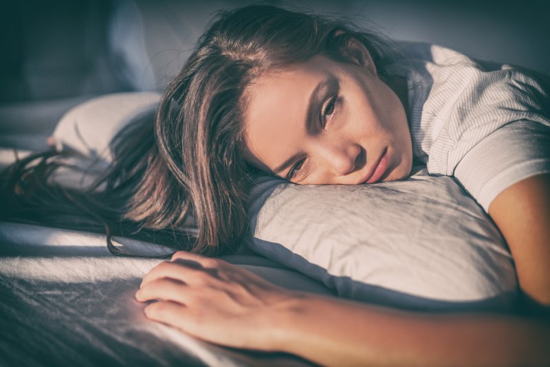 Young woman trying to sleep