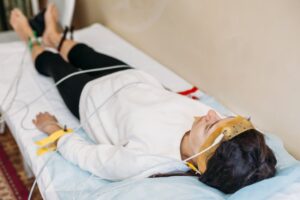 Young person having sleep study conducted.
