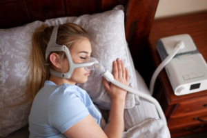 Woman sleeping with a CPAP