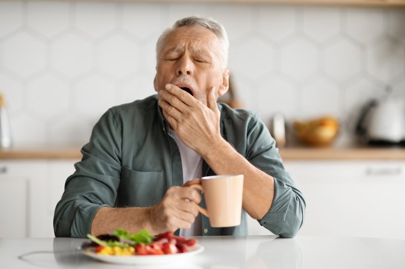 a man yawning from fatigue in the morning